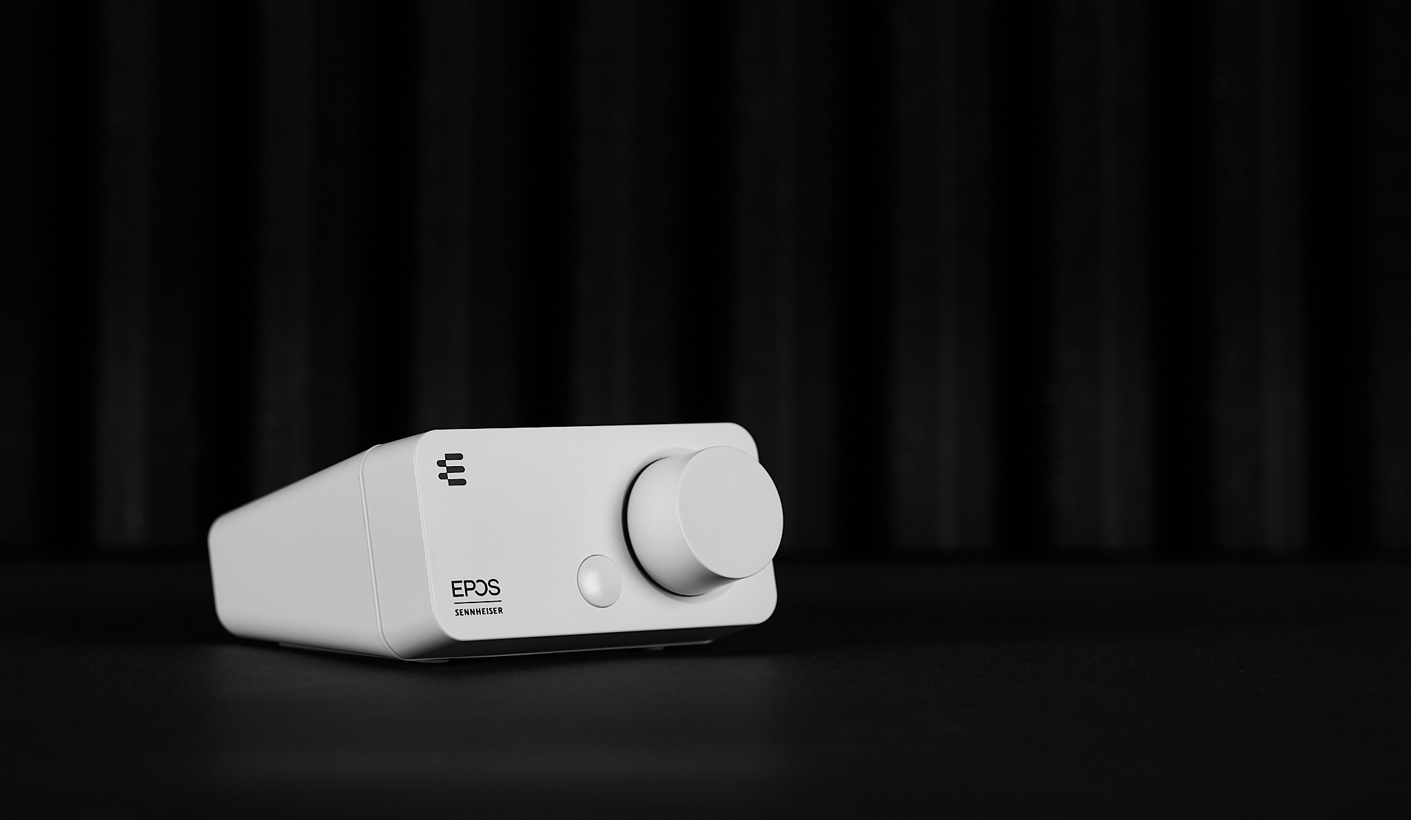 A white external sound card.