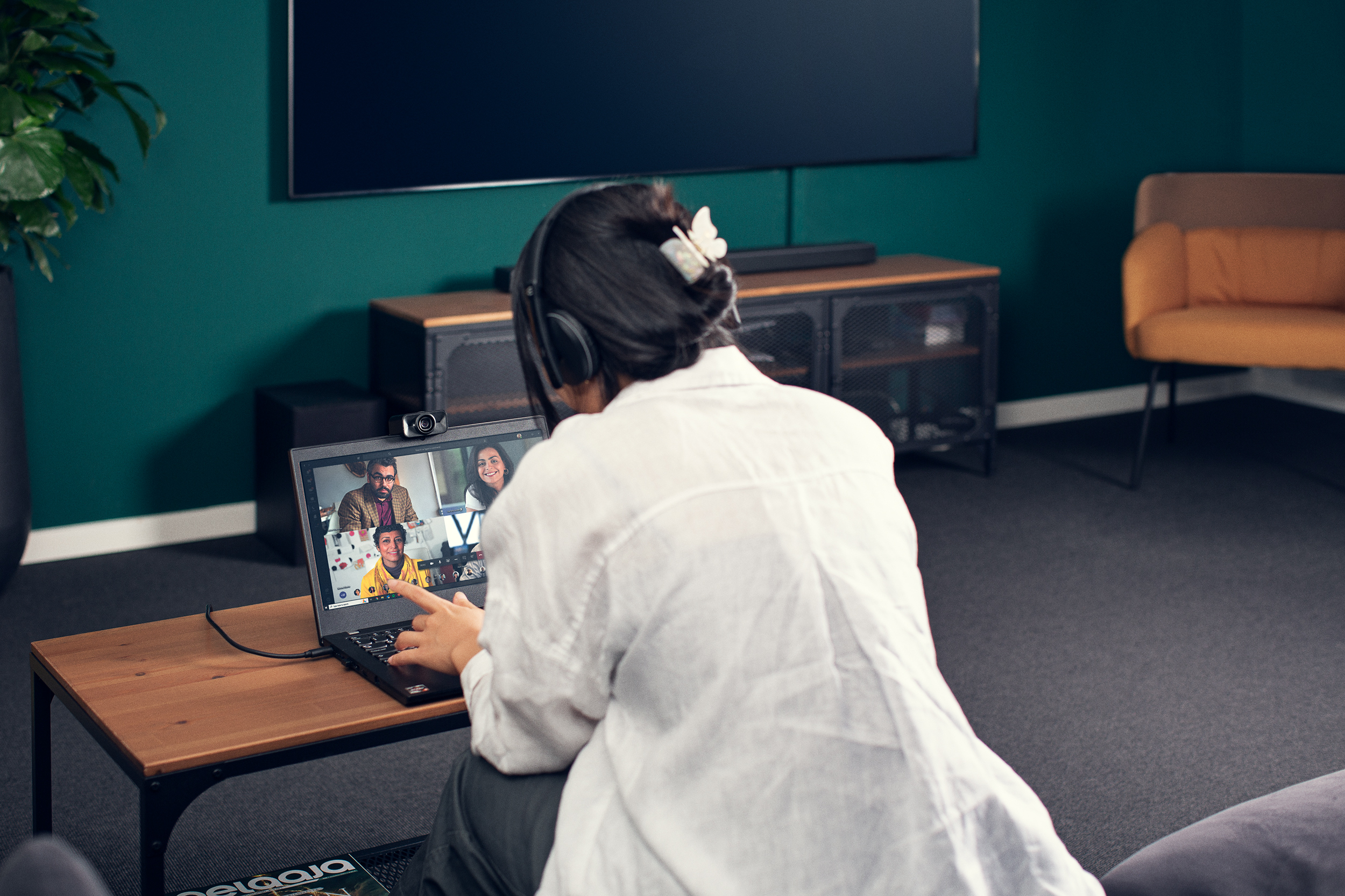 A man talking to a virtual meeting on his laptop.
