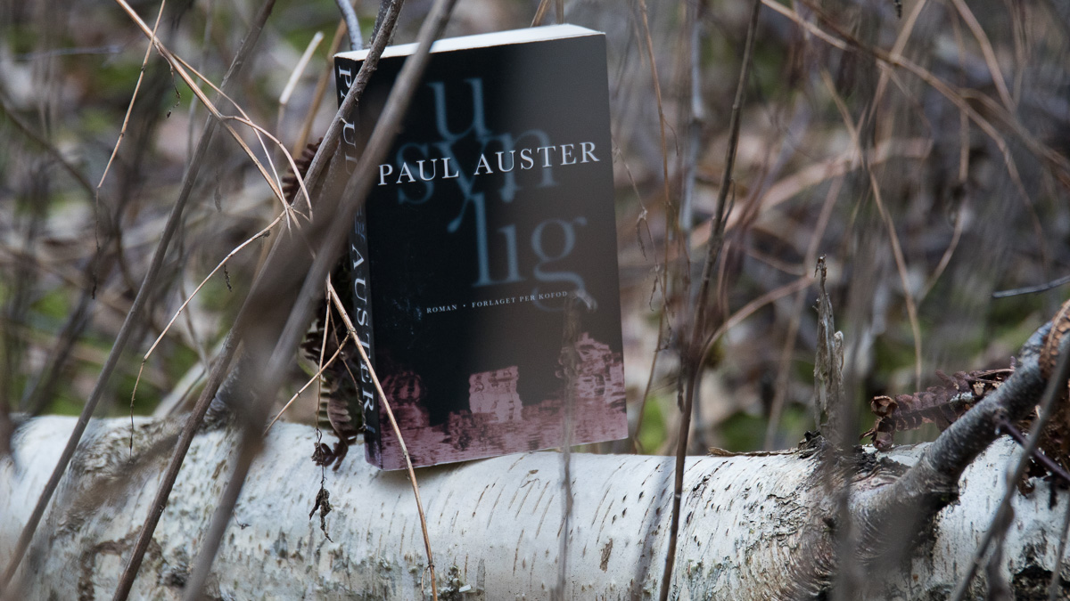 A book on a tree that has fallen down.
