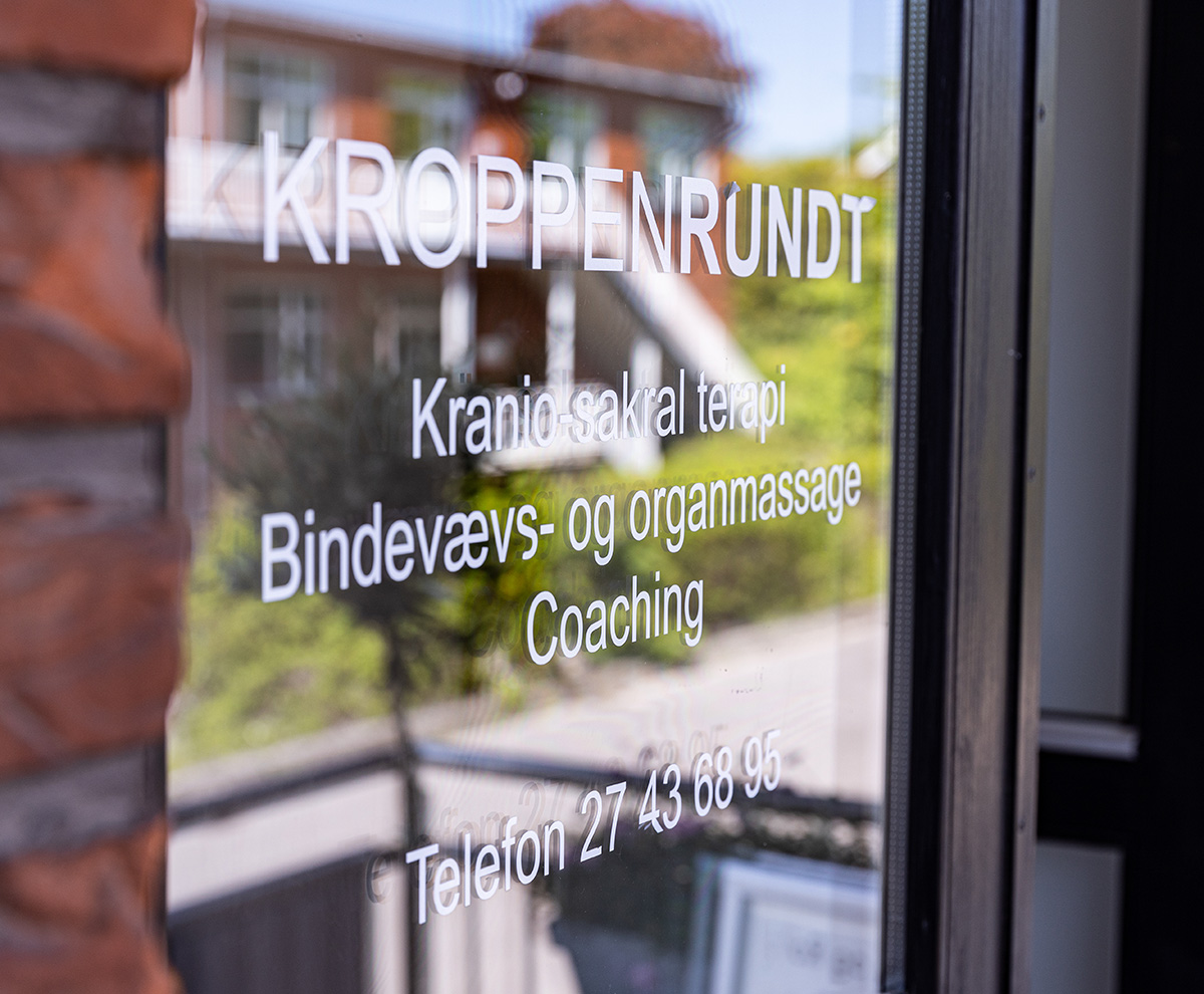 A glass door with text on it.
