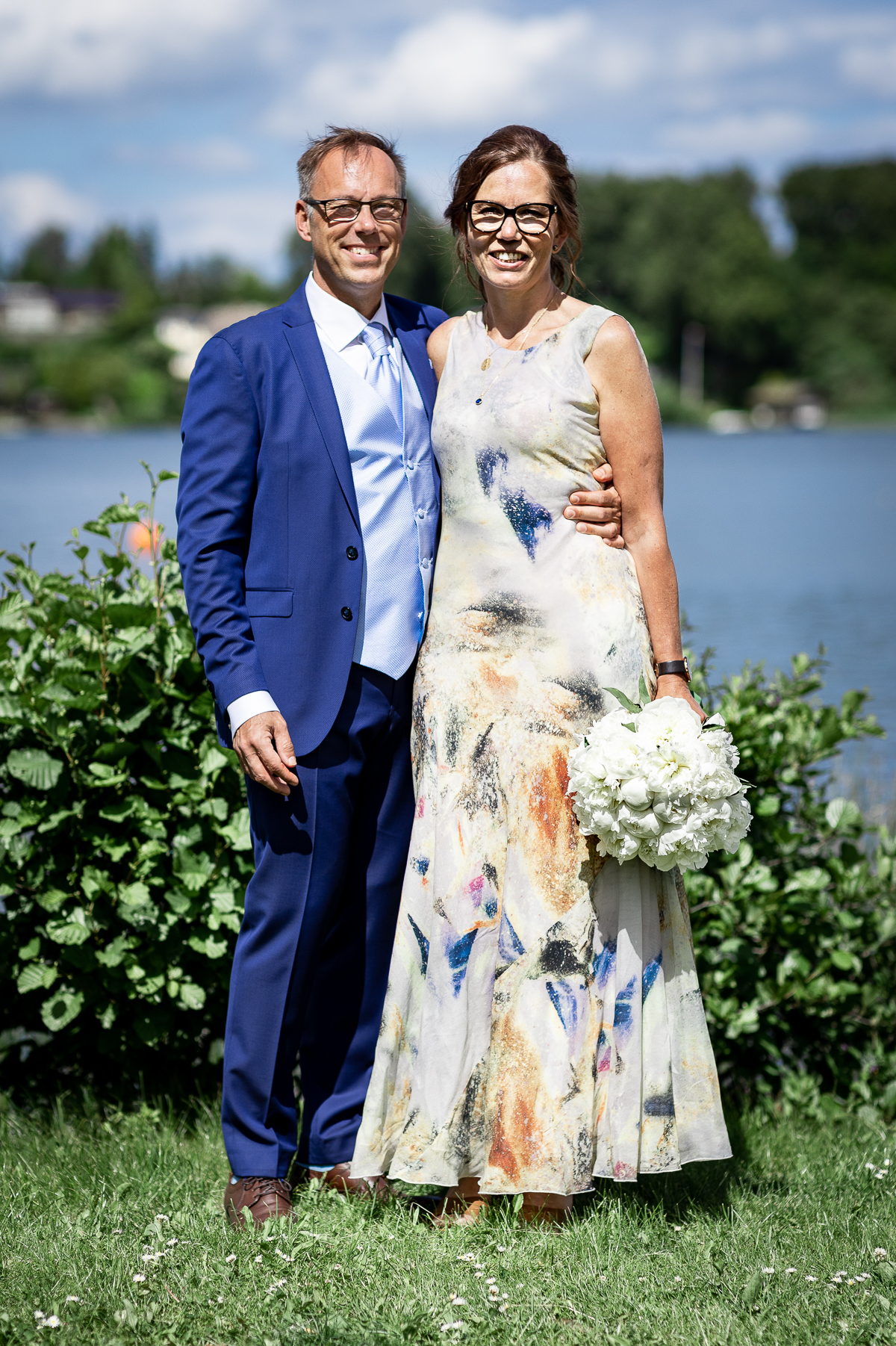 The bride and groom smiling.
